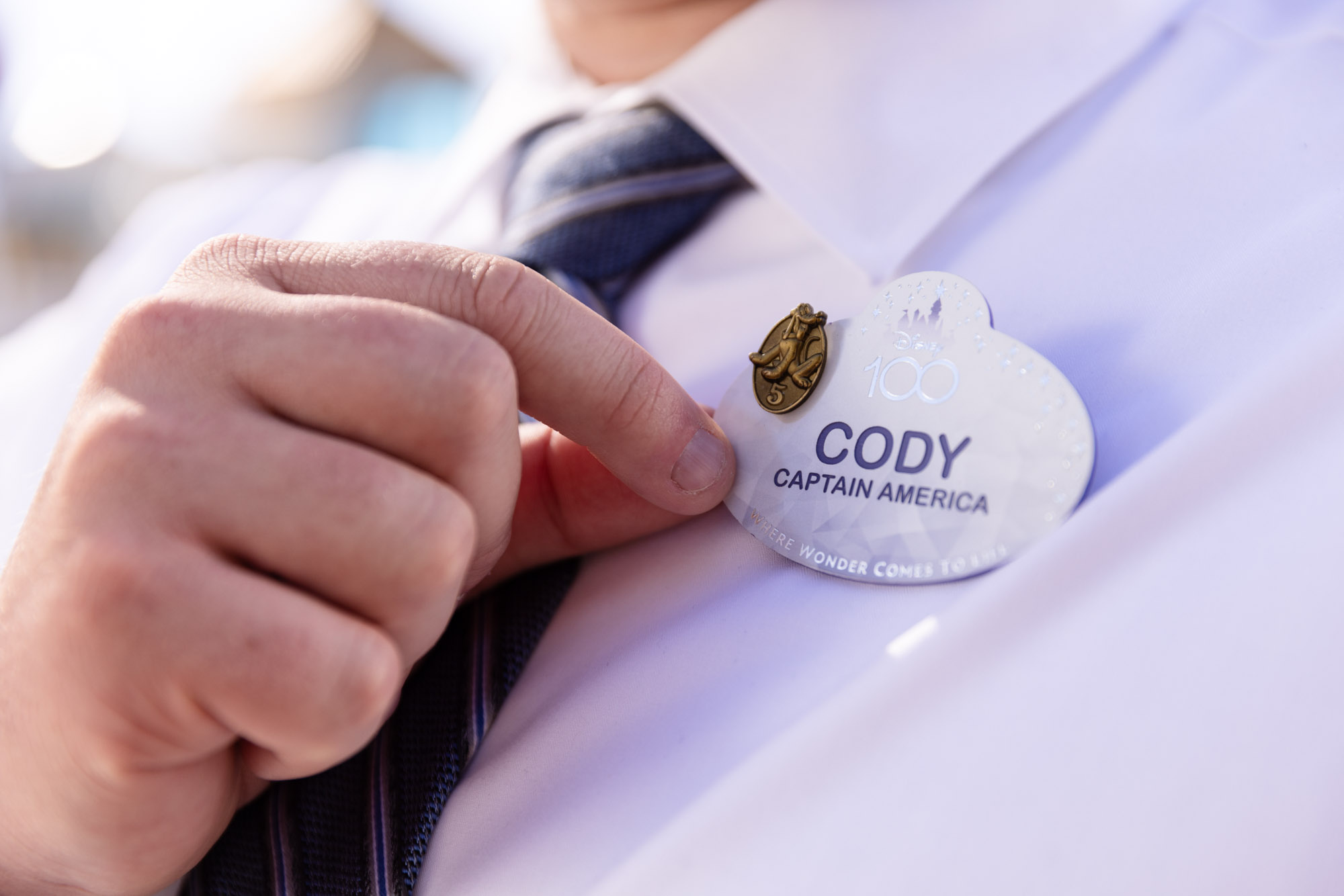 Cast member name tag for Disney 100 celebration