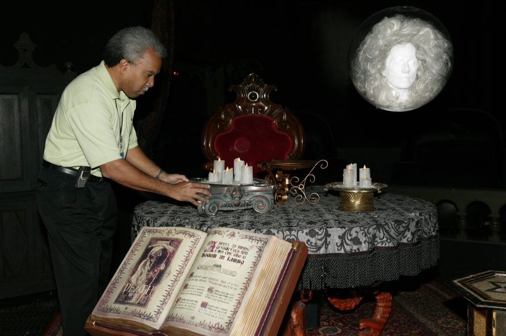 Lanny Smoot with floating Madame Leota inside the Haunted Mansion attraction