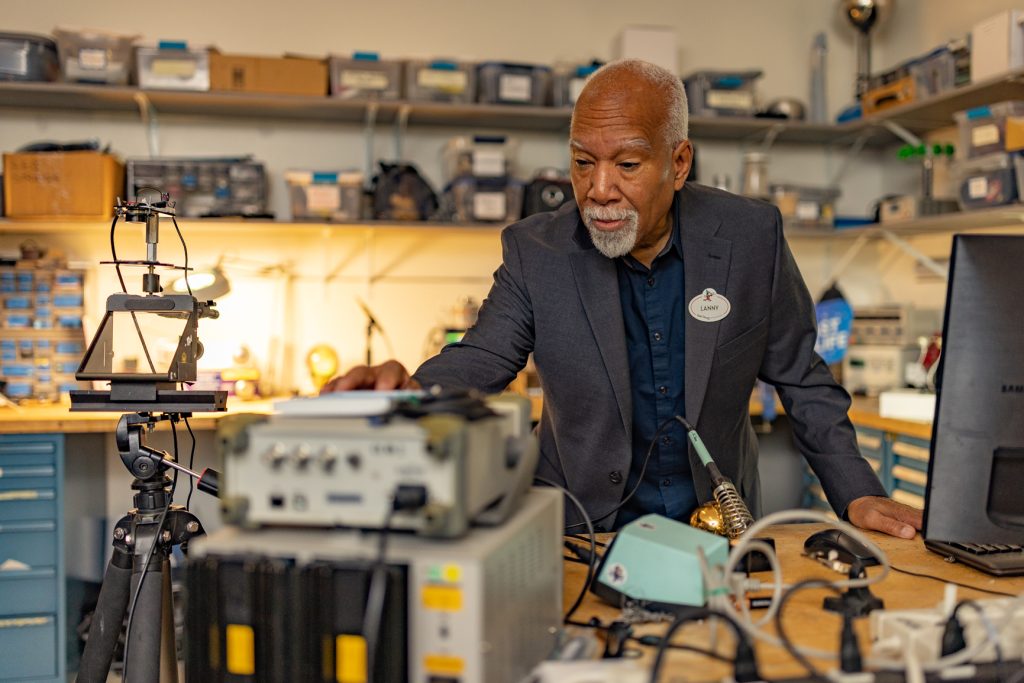 Disney Imagineer Lanny Smoot examines piece of technology