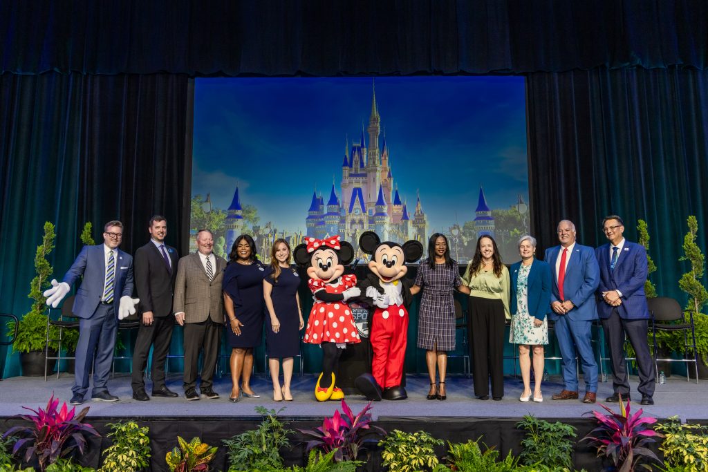 ESPN Wide World of Sports posing with Mickey and Minnie