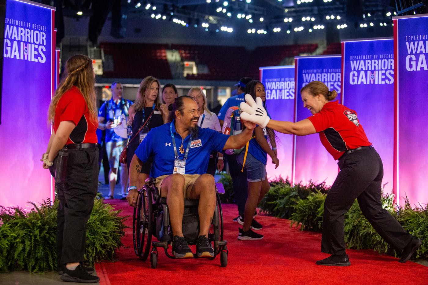 Disney cast members welcoming Warrior Games athletes.