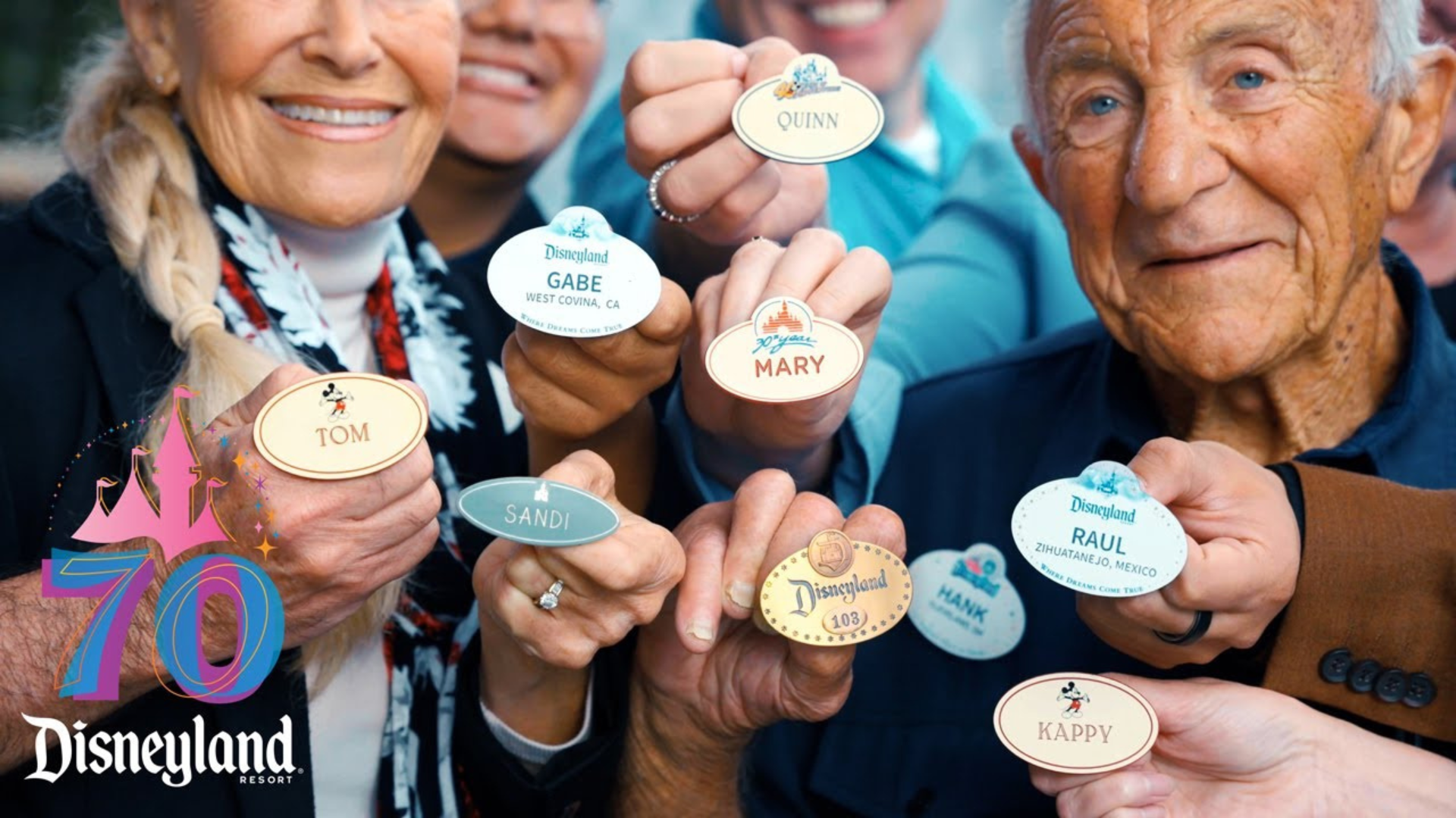 Various Disneyland cast members hold up their nametags