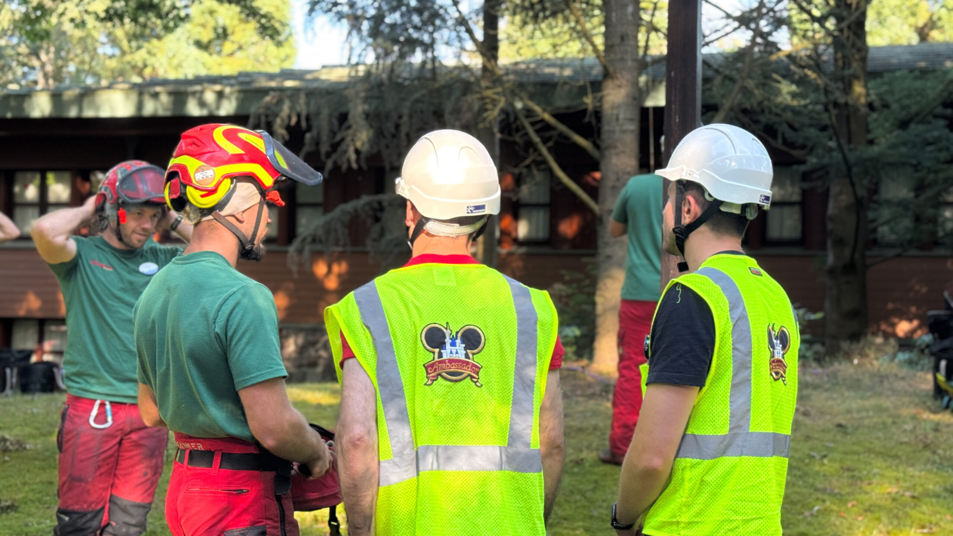Disney Ambassadors wear hardhats and reflective vests at Disneyland Paris