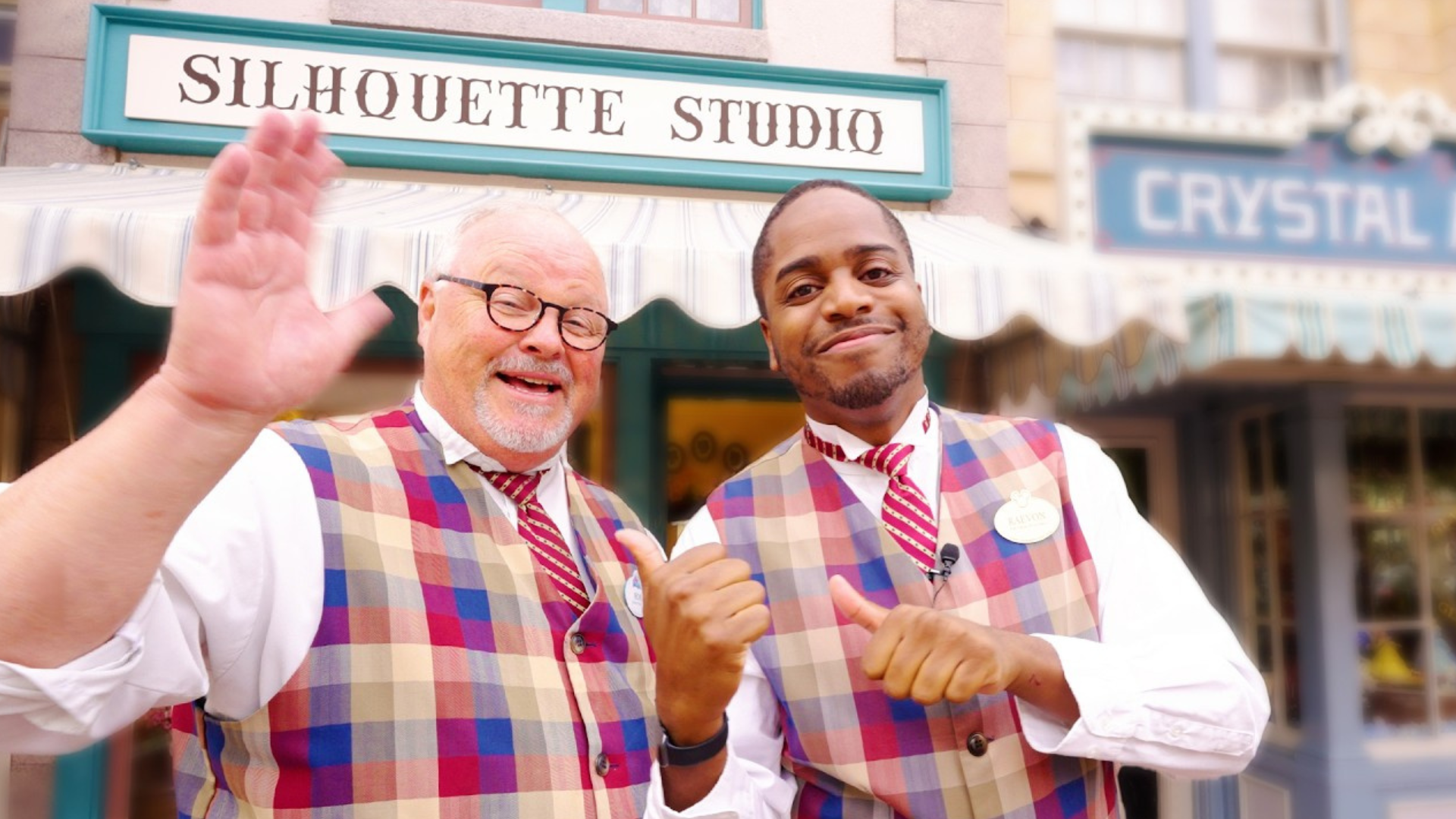Two Disney cast members pose in front of Silhouette Studio