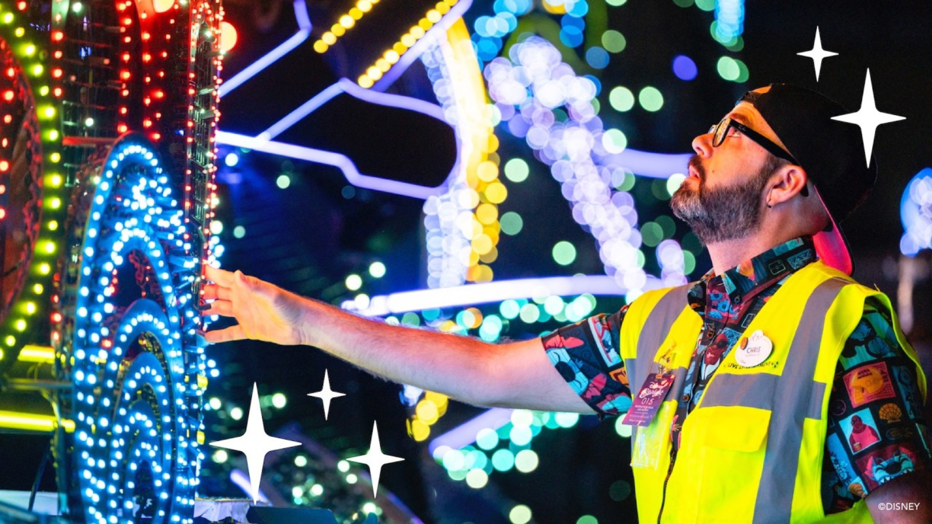 A Walt Disney Imagineer looks at a float that has lots of lights on it