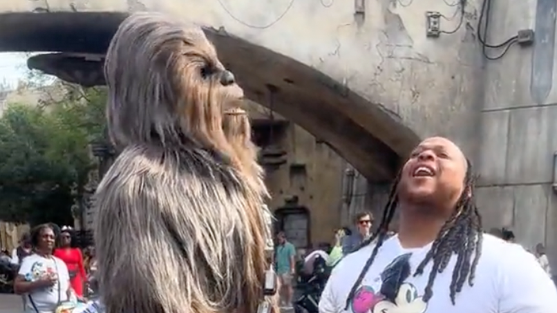 A man roars with Chewbacca at Galaxys Edge