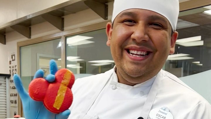 Disney Chef holding a Macaron