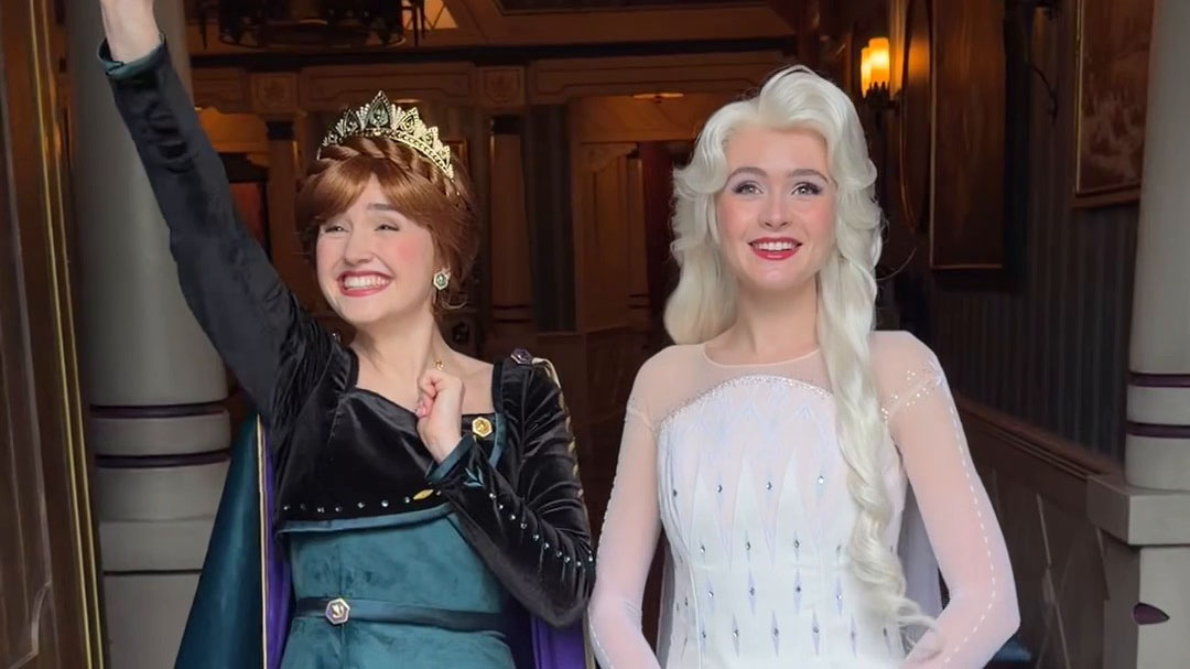 Anna and Elsa wave