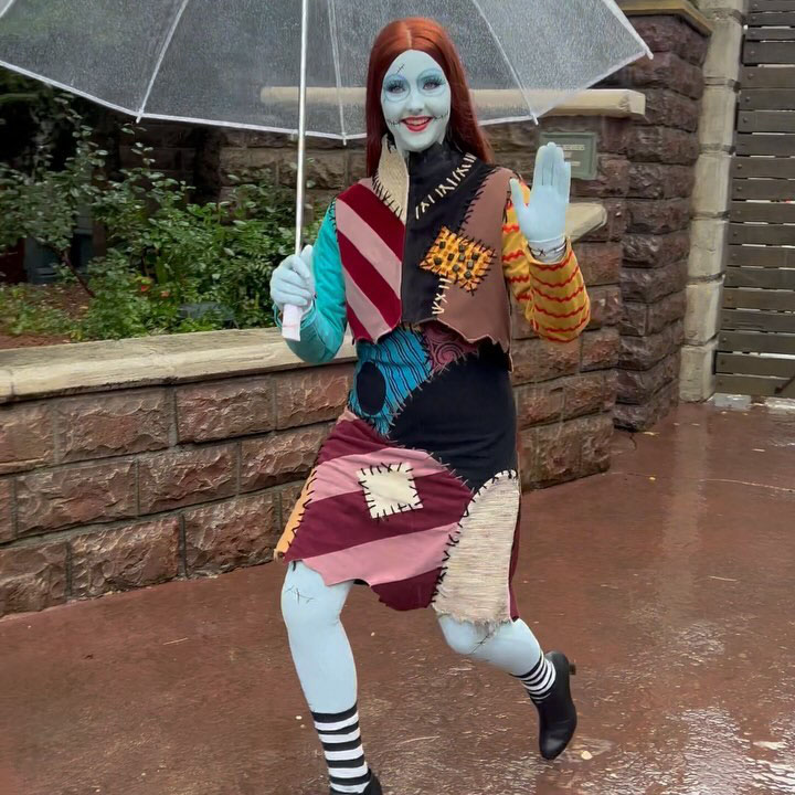 Sally from The Nightmare Before Christmas walking under an umbrella