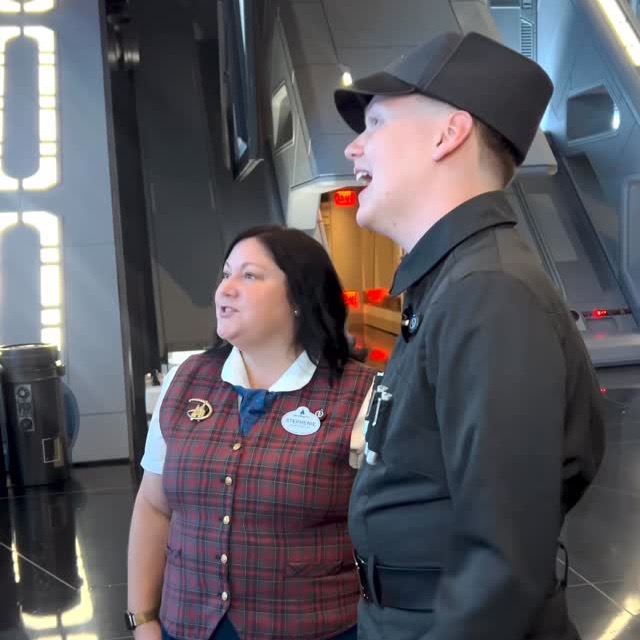 Two cast members standing together on Rise of the Resistance ride