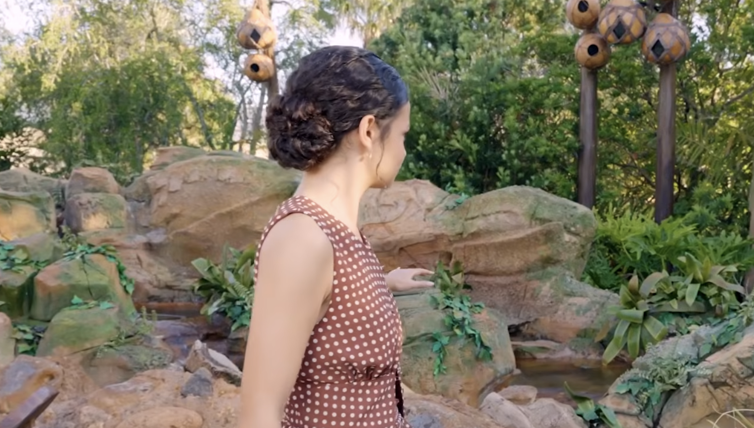 Catherine Laga'aia stands in front of a large topiary shaped like Te Fiti from Disney&rsquo;s Moana.