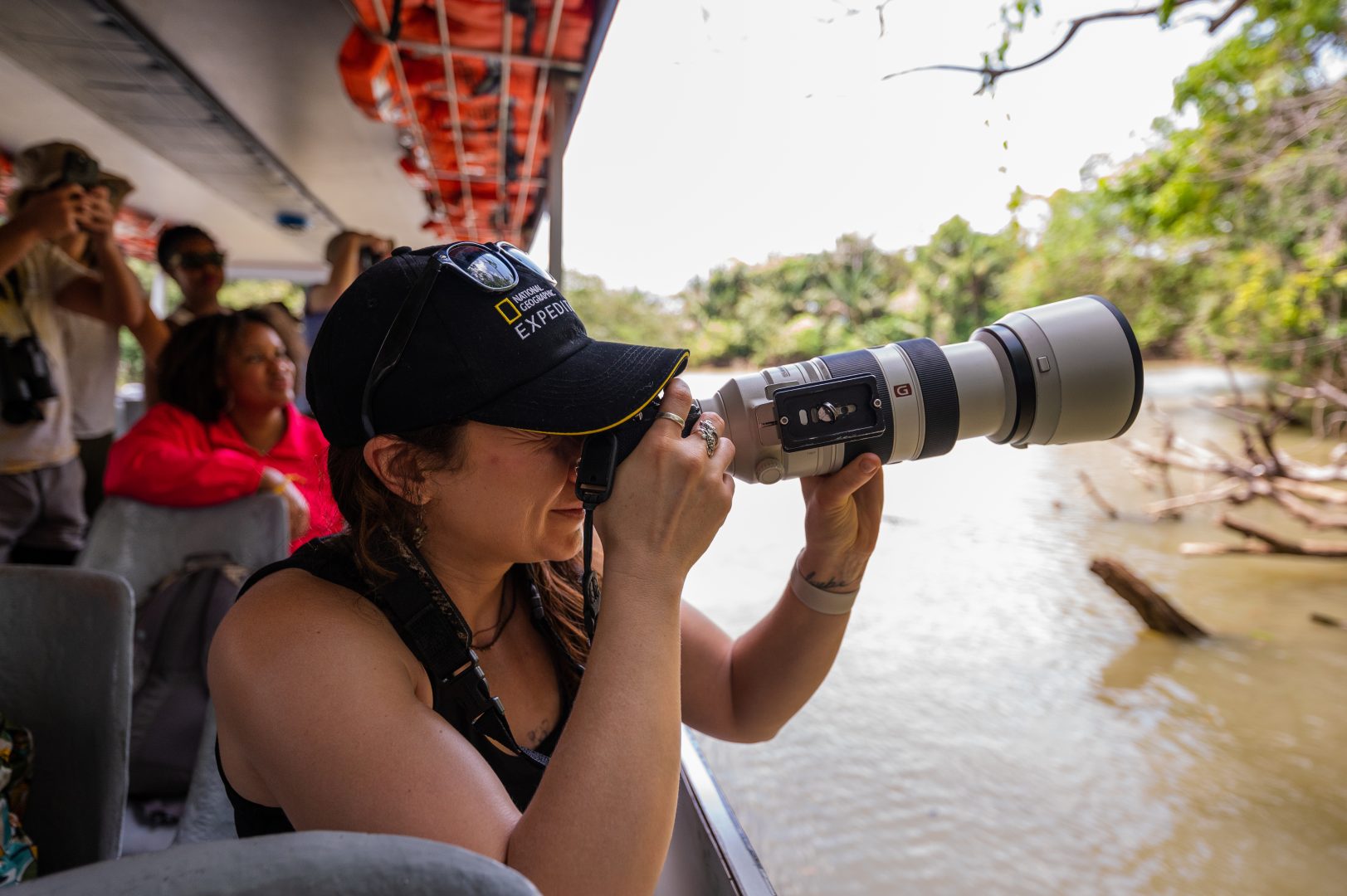 A guest on a National Geographic Expeditions trip learns tips for photography.