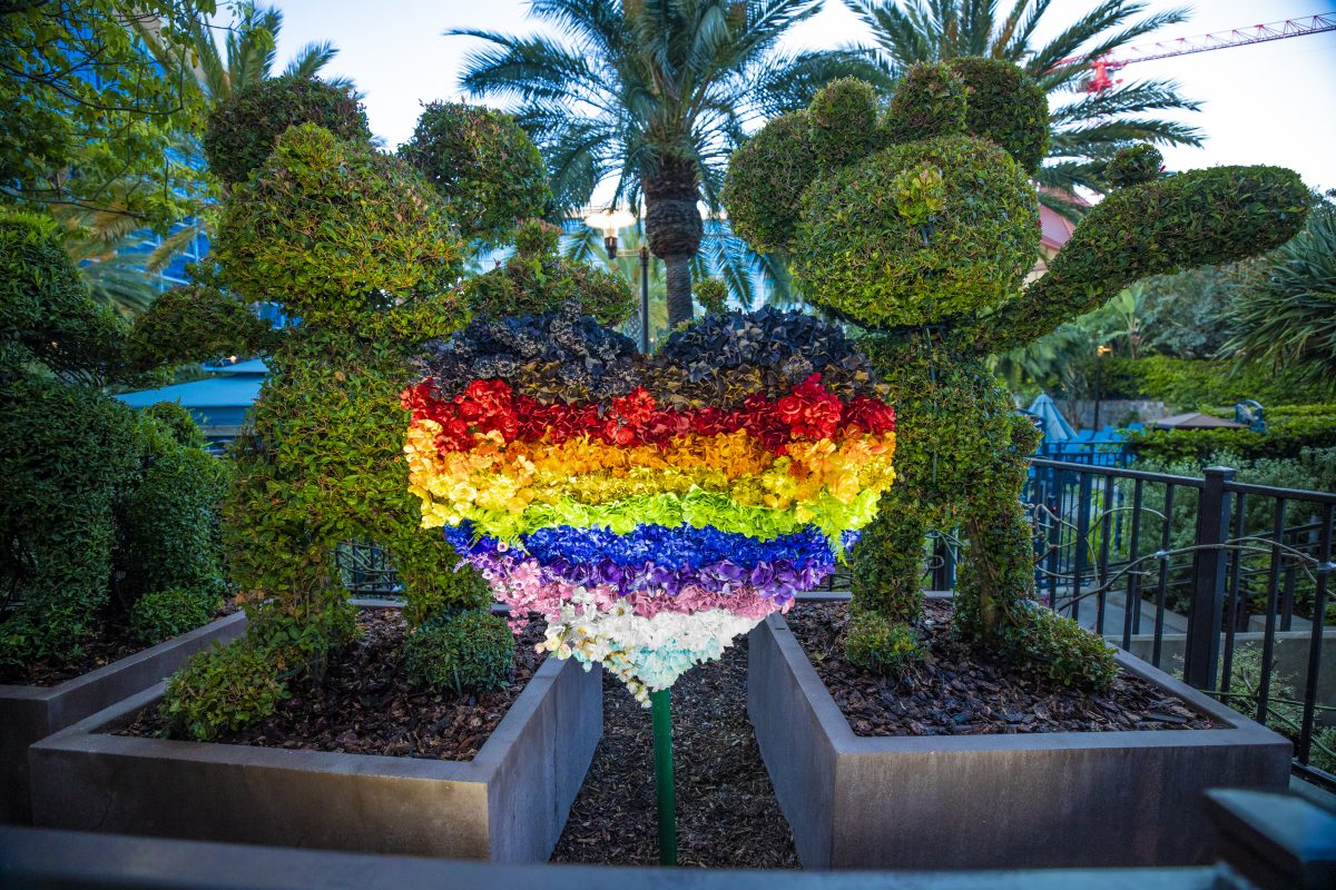 Mickey and Minnie topiary with a rainbow heart.