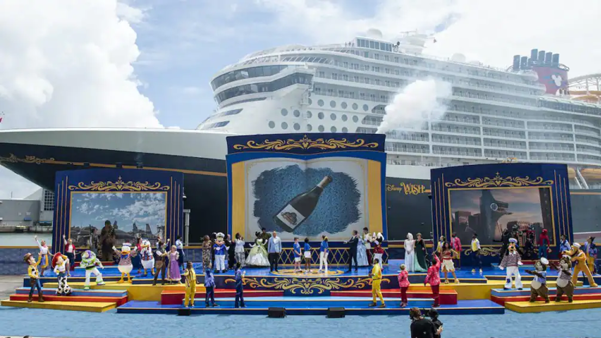 Performers and Executives onstage at the Wish Christening in front of the new ship.