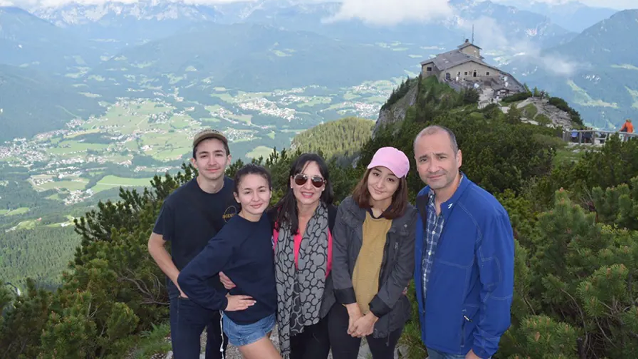 Lily with her three kids and husband overseas. 