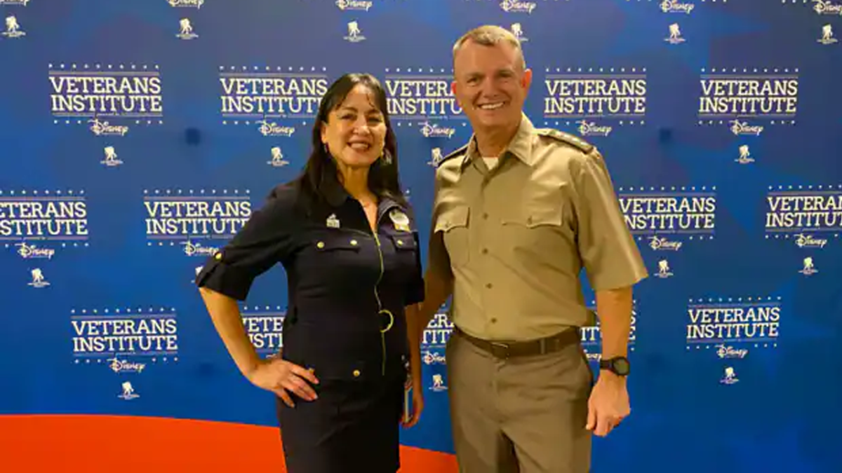 Lily with her husband in a military uniform.