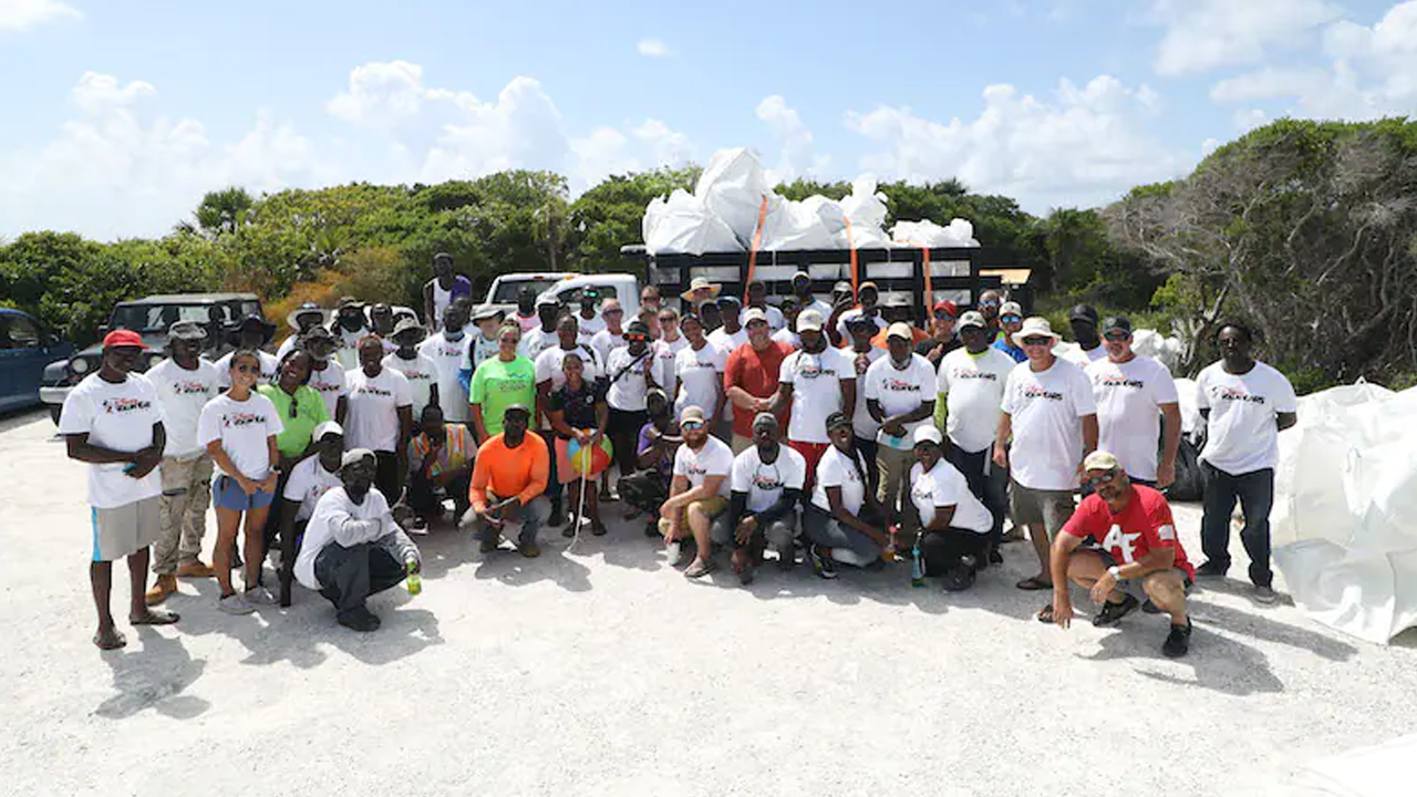 Group photo of the VoluntEARS taken on the beach. 