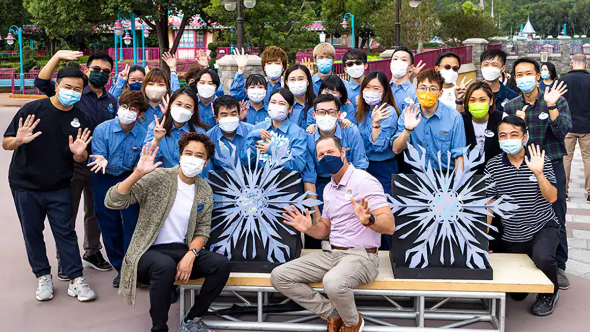 Cast Members posing with the snow flakes.