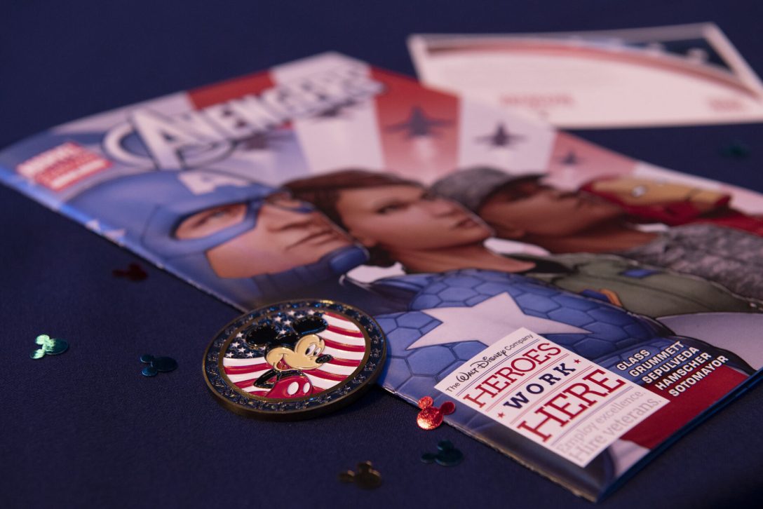 heroes work here pin and pamphlets on a table