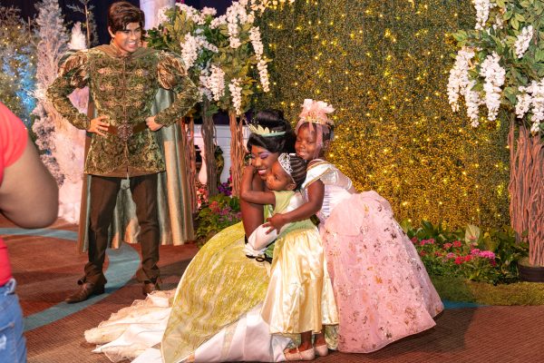 princess tiana hugs children