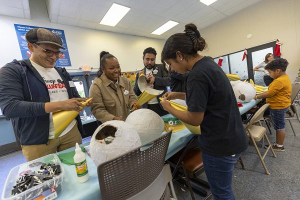 Disney ambassadors build pinatas with kids