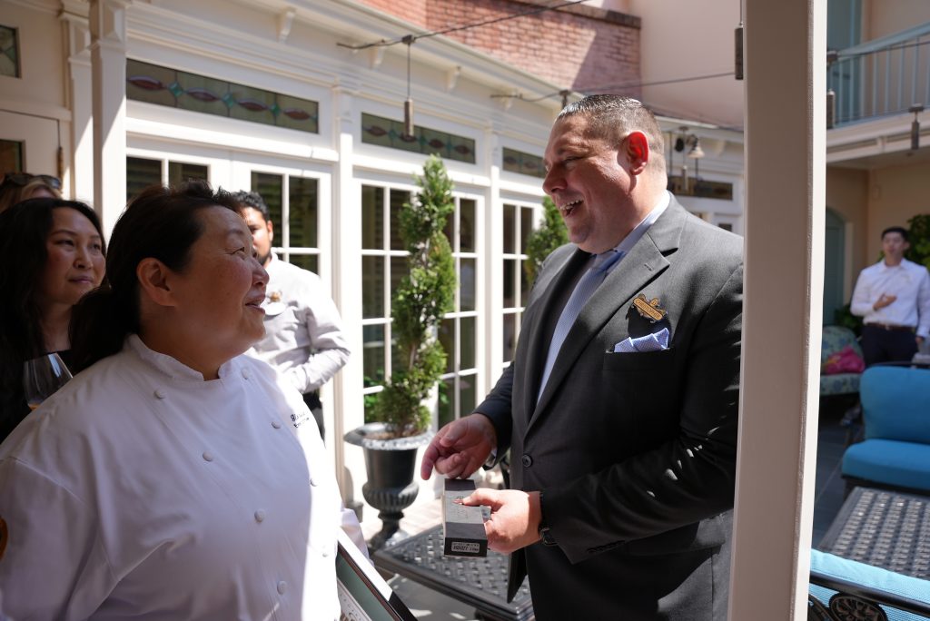 Christopher Moran presenting Chef Gloria with a special knife.