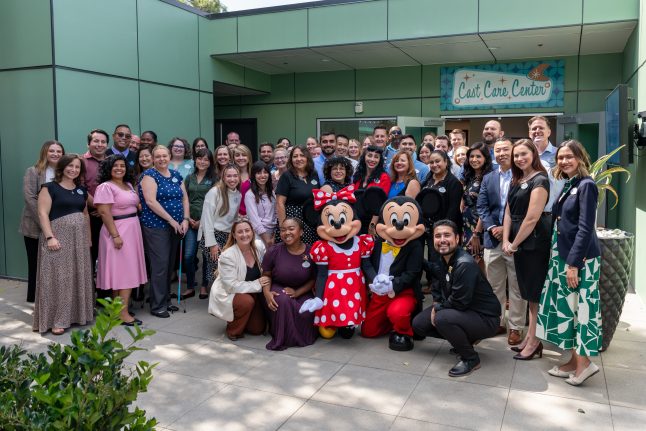 Cast Care Leaders smile in front of new Cast Care Center.