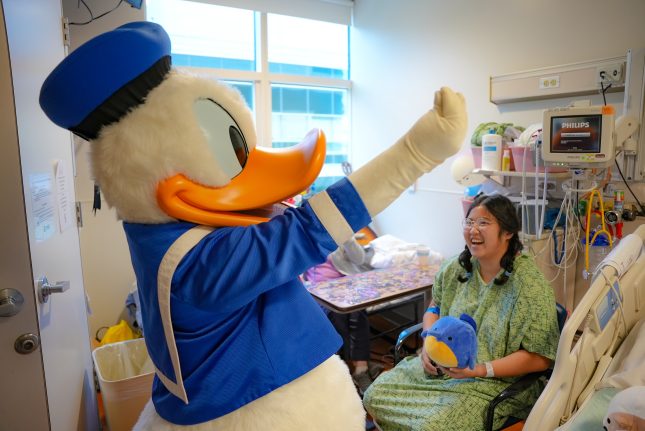 Donald Duck creates joyful memories with a patient at CHOC.