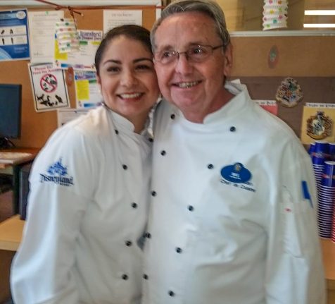 Amy Benson and Chef Bill pose for a picture.