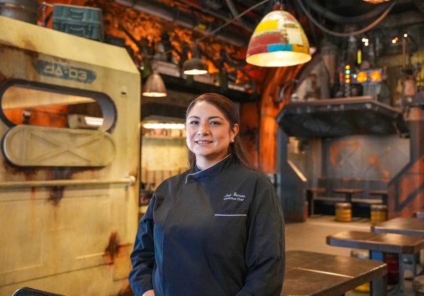 Executive Chef Amy Benson smiles in Docking Bay 7 Food and Cargo at Star Wars: Galaxy’s Edge.