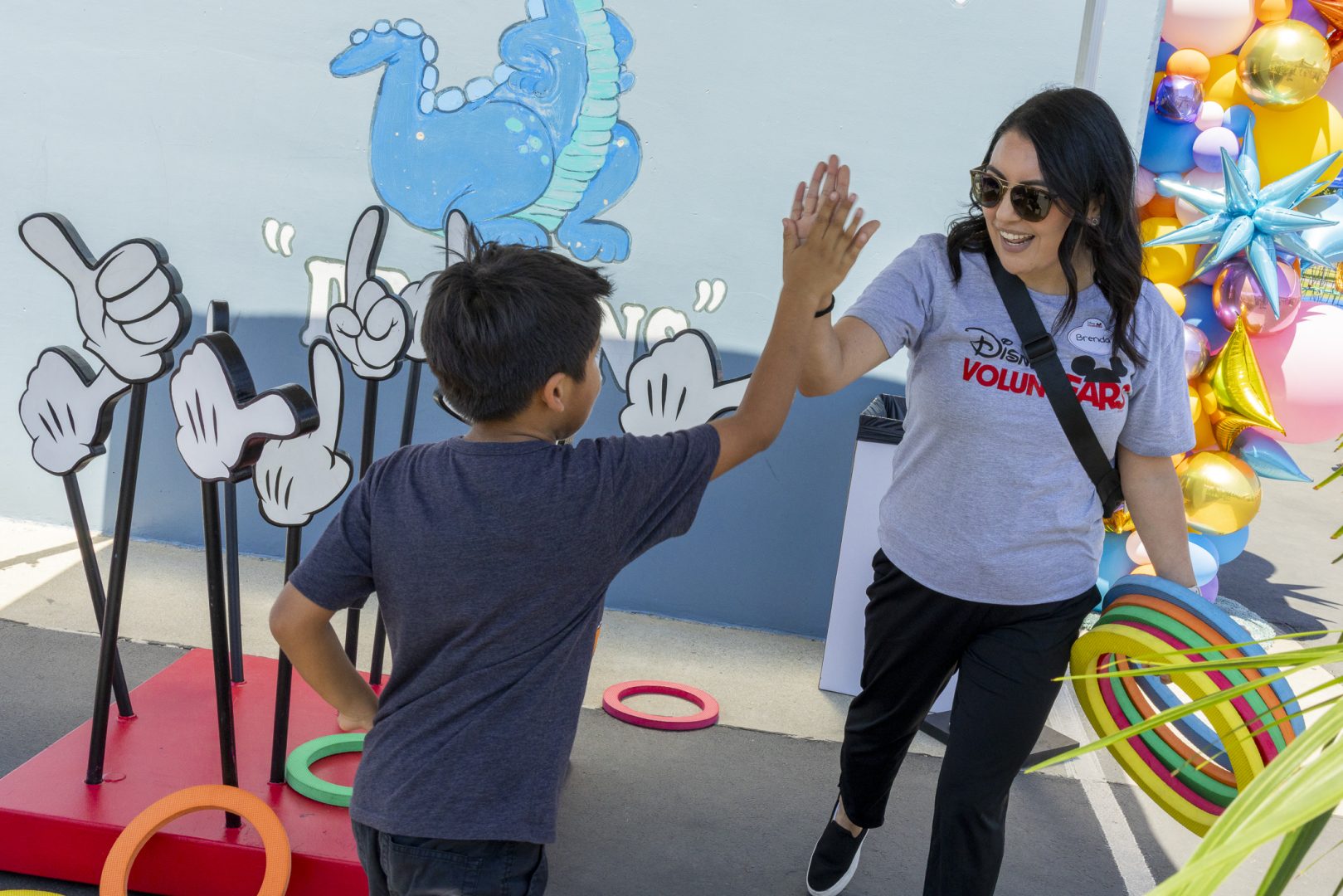 Disney VoluntEARS play games with Anaheim residents during the 70 Happiest Hours in Anaheim initiative. 
