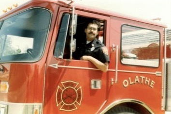 Fire Captain Mark Solano driving the firetruck at a station in Olathe, Kansas.