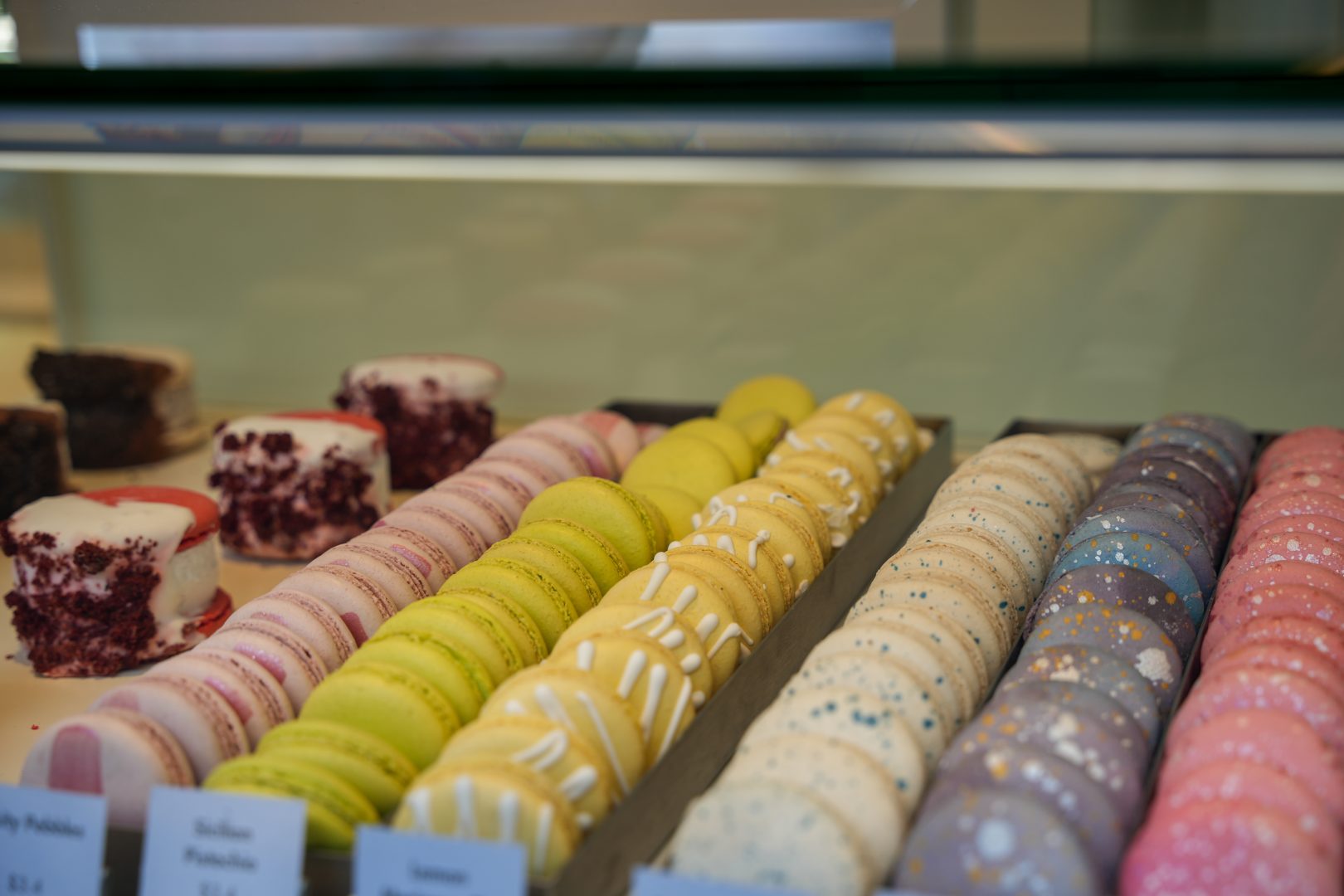 Rows of colorful French macarons awaits guests at the Kayla’s Cake cart in Downtown Disney District.