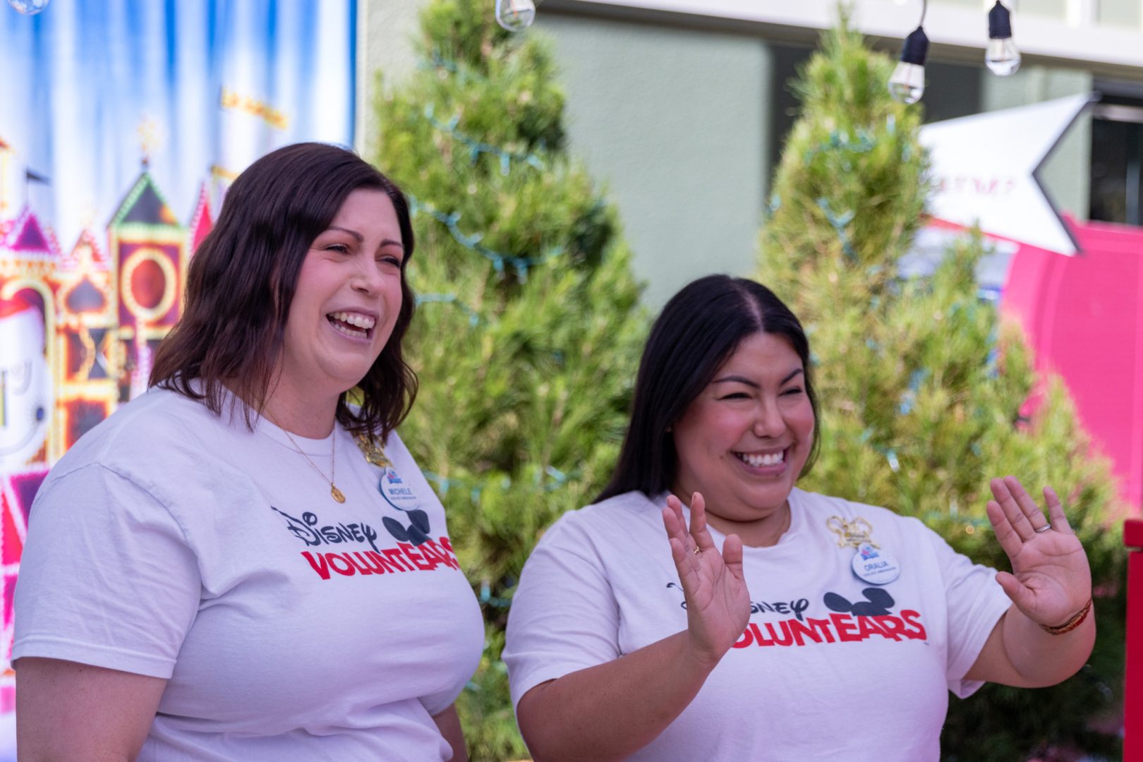 2026-2027 Disney Ambassadors of Disneyland Resort Michele and Oralia engaging with cast members at a Disney Ultimate Toy Drive for Toys for Tots event.
