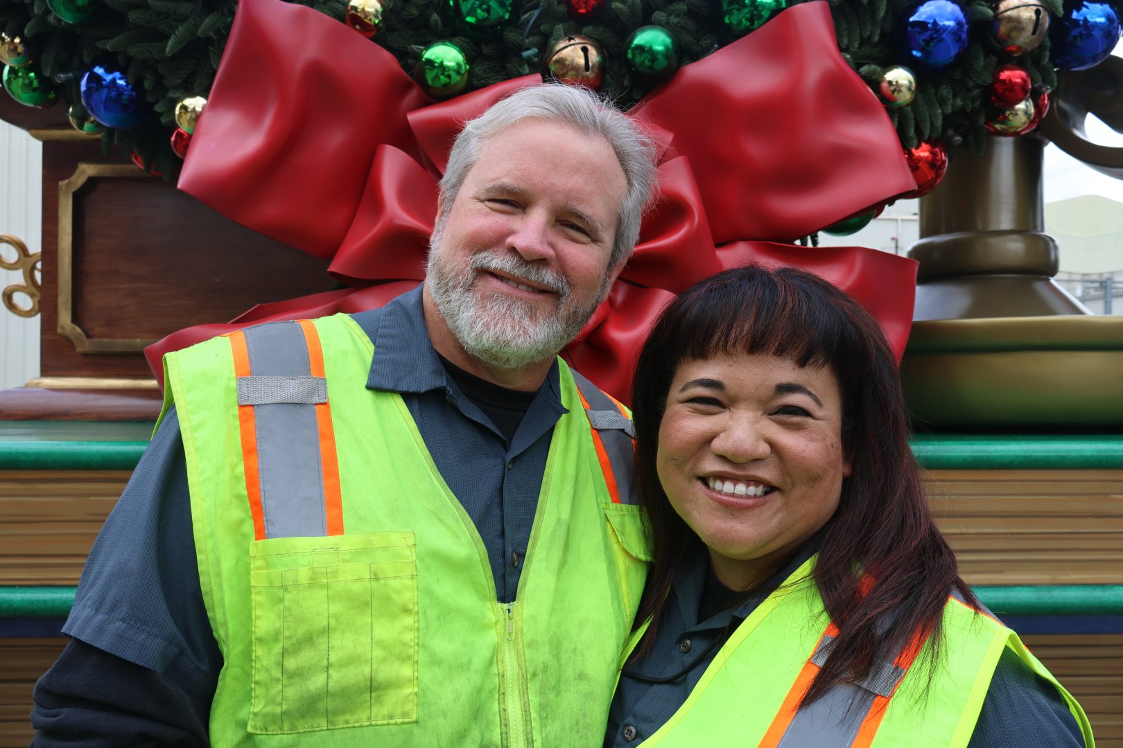 Ken and Christine posing before their first “A Christmas Fantasy Parade” shift together this season.