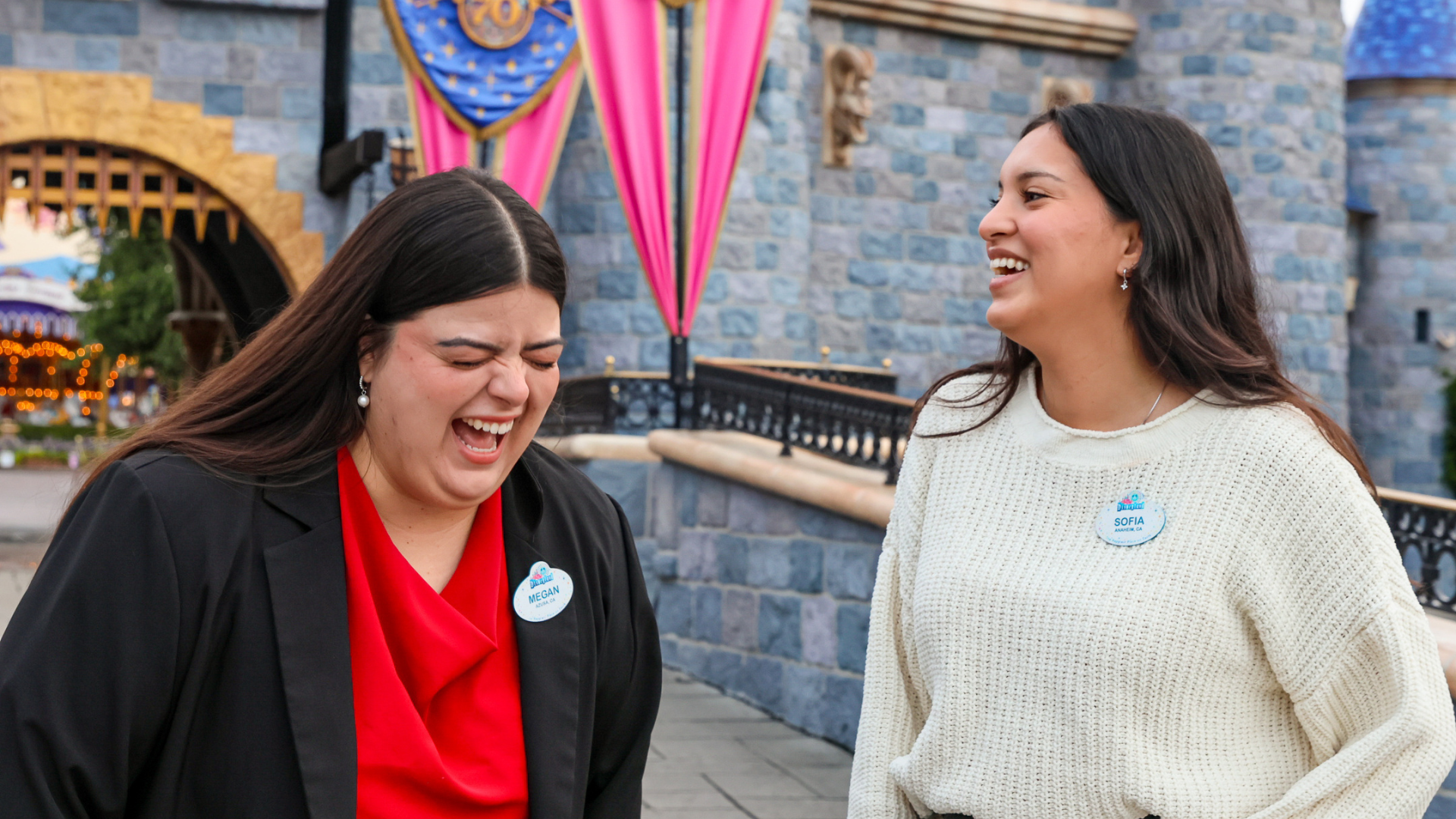The pair burst into smiles and laughter in front of Sleeping Beauty Castle at Disneyland park, while reminiscing their shared memories from the program.